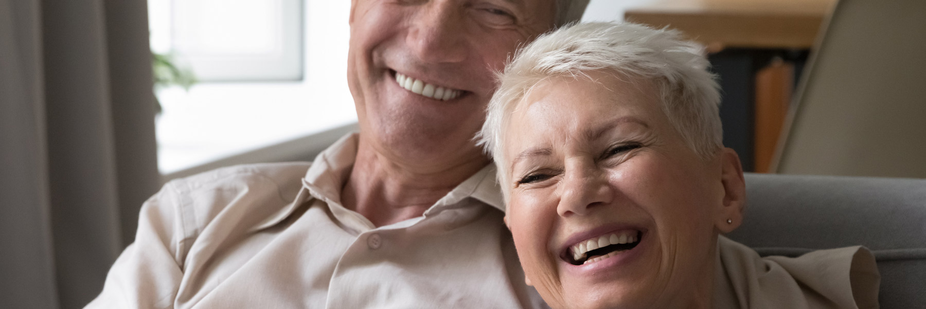 Man and woman happy with their dental implants from dentist in Idaho Falls, Dr. Michael Elison.