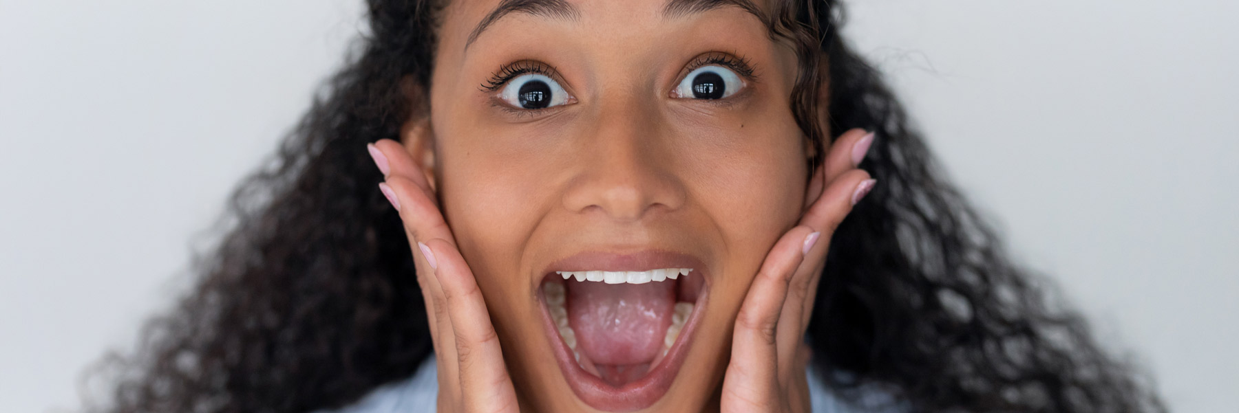 Woman smiling after receiving a metal free filling at her family dentist in Idaho Falls, Dr. Michael Elison.