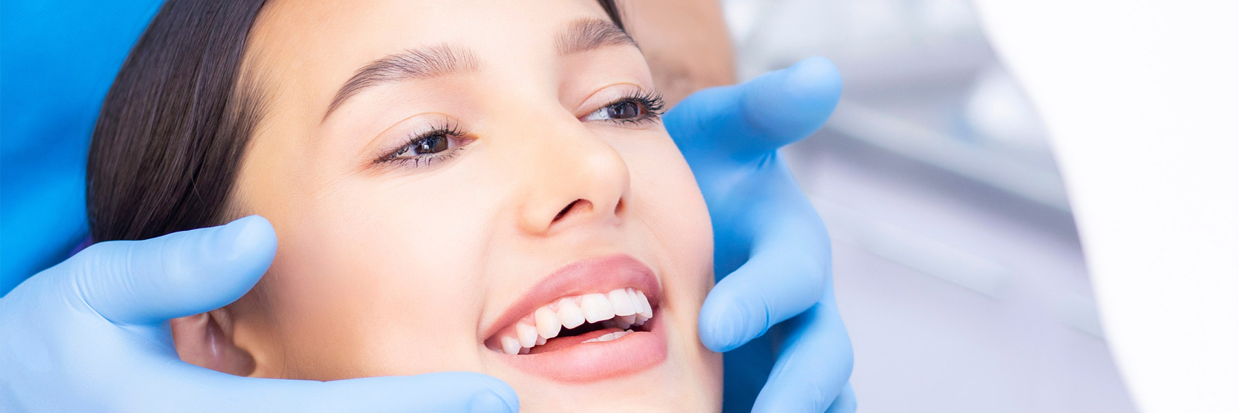 Woman at the dentist in Idaho Falls getting an oral cancer screening.